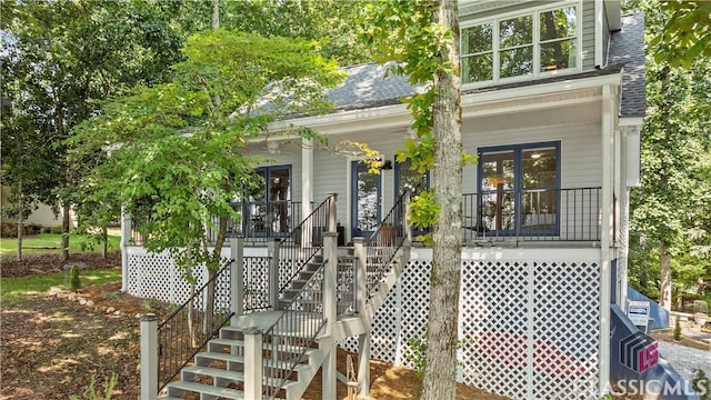 2061 Sugar Creek Trl, Buckhead, GA 30625 - view of exterior entry featuring a shingled roof and covered porch