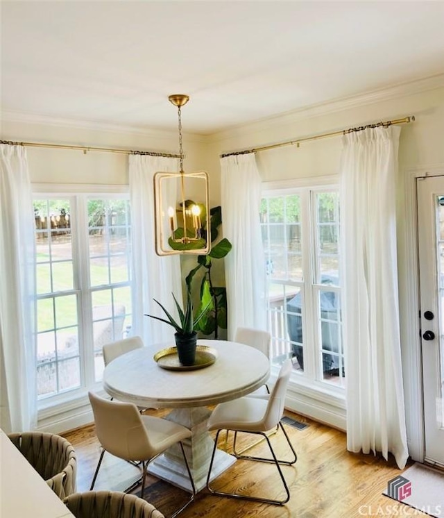 1105 Harperfield Dr, Bogart, GA 30622 - dining room with crown molding and light wood finished floors
