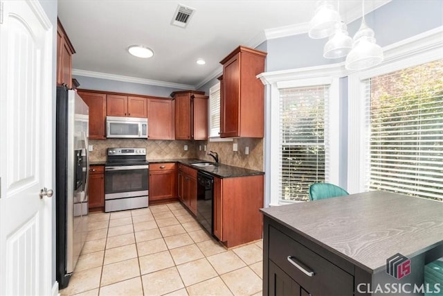 232 Township Ln, Athens, GA 30606 - kitchen featuring stainless steel appliances, dark countertops, light tile patterned floors, backsplash, and crown molding