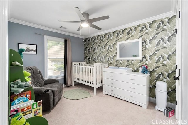 232 Township Ln, Athens, GA 30606 - carpeted bedroom with ornamental molding, a crib, ceiling fan, and an accent wall
