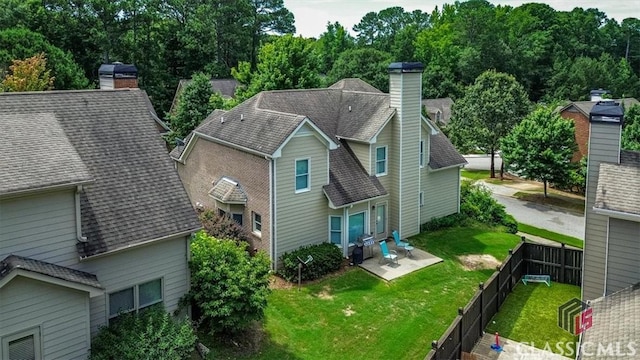 232 Township Ln, Athens, GA 30606 - rear view of house featuring a chimney, a fenced backyard, a patio, and roof with shingles