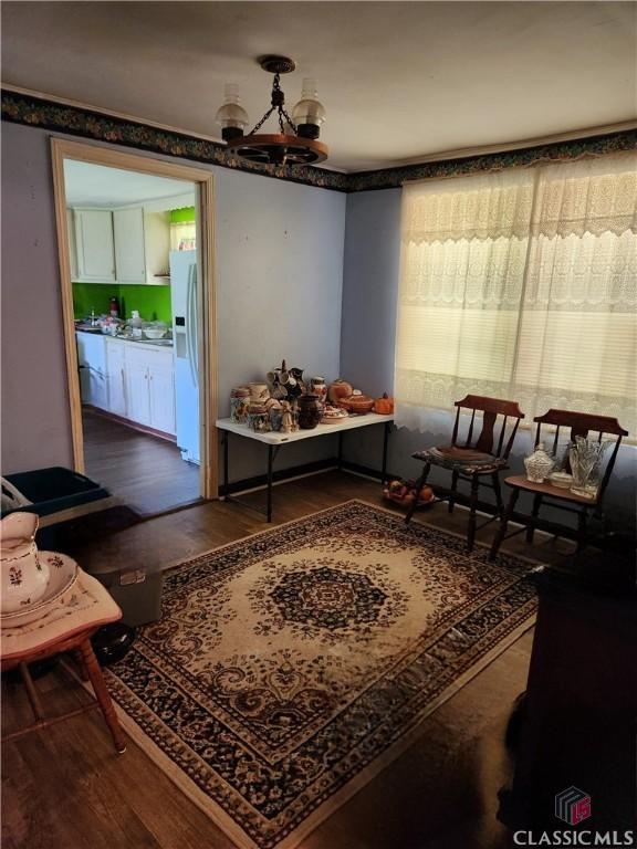 4660 Fairplay Rd, Madison, GA 30650 - living area with wood finished floors and a chandelier