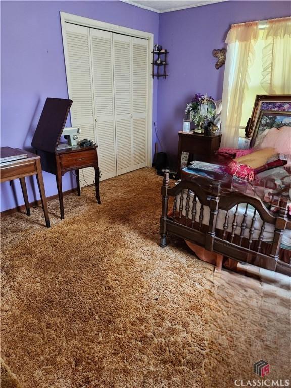 4660 Fairplay Rd, Madison, GA 30650 - bedroom featuring a closet and carpet floors