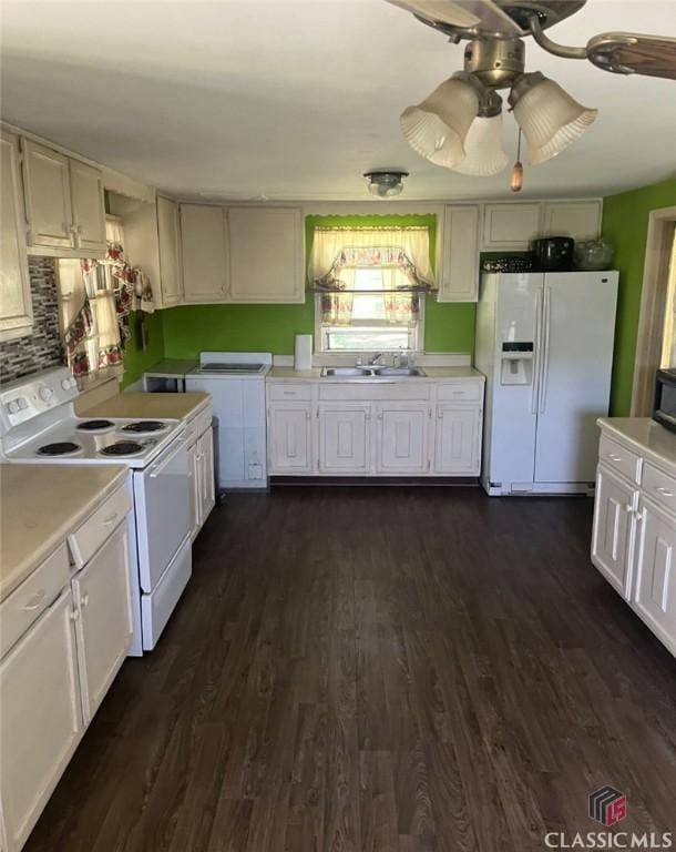 4660 Fairplay Rd, Madison, GA 30650 - kitchen featuring white appliances, light countertops, dark wood-style flooring, and a ceiling fan