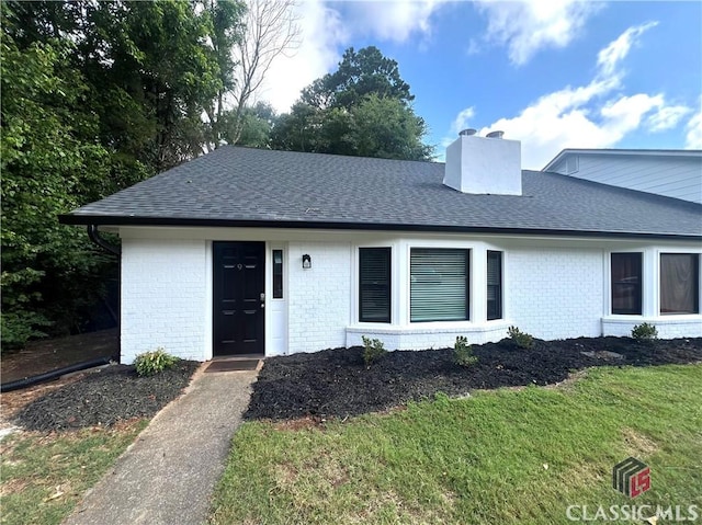 595 Macon Hwy Unit 9, Athens, GA 30606 - view of front of house featuring a chimney, brick siding, and a shingled roof