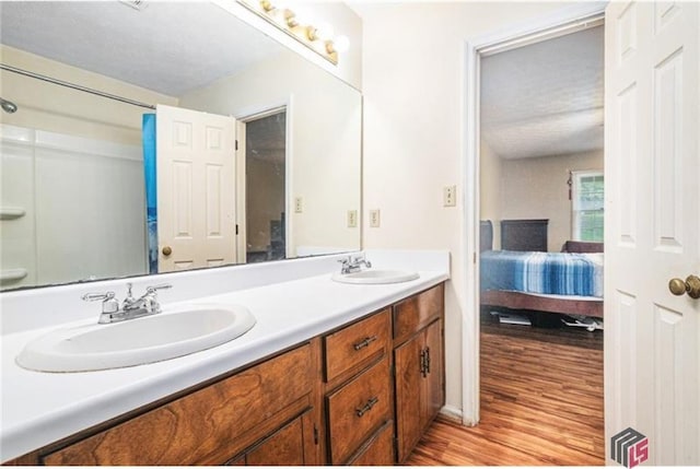 256 Frederick Dr, Athens, GA 30607 - ensuite bathroom with double vanity and wood finished floors