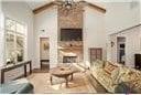 1069 Dean Hill Rd, Monroe, GA 30655 - living area featuring a fireplace, a chandelier, and lofted ceiling