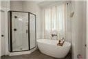 1069 Dean Hill Rd, Monroe, GA 30655 - full bath featuring a shower stall and a soaking tub