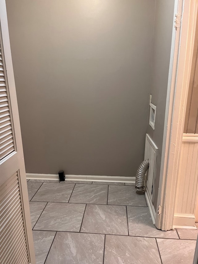 washroom featuring washer hookup, baseboards, and electric dryer hookup