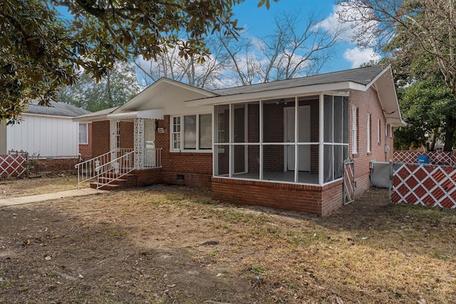 view of front of house featuring a sunroom