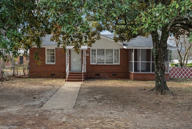 view of front facade with a sunroom