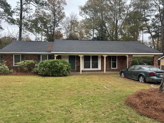 single story home with a front yard