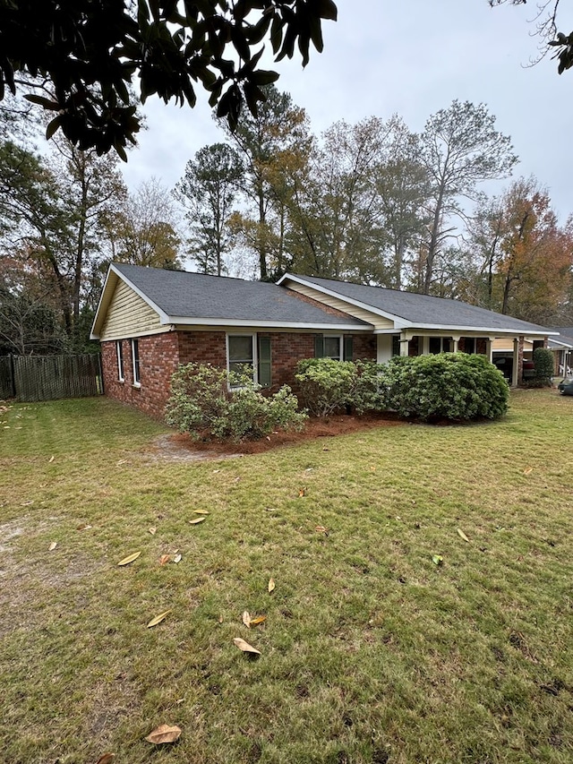 view of property exterior featuring a lawn