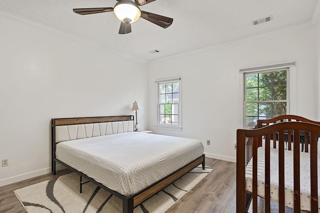 6426 Springwater Dr, Columbus, GA 31904 - bedroom with light wood-style flooring, crown molding, and a ceiling fan
