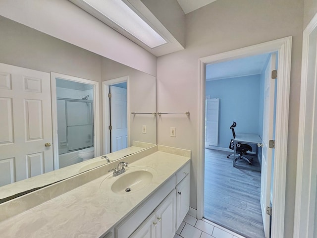 6426 Springwater Dr, Columbus, GA 31904 - bathroom featuring a shower with shower door, vanity, and tile patterned floors