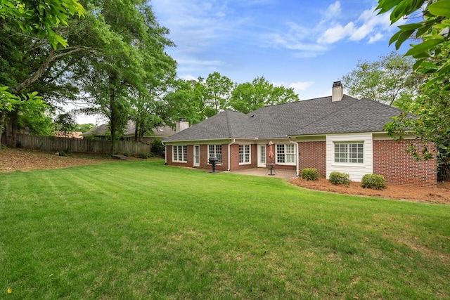 6426 Springwater Dr, Columbus, GA 31904 - back of house with a chimney, brick siding, a patio area, and roof with shingles