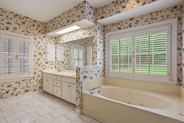 6426 Springwater Dr, Columbus, GA 31904 - bathroom featuring wallpapered walls, double vanity, a jetted tub, and tile patterned floors