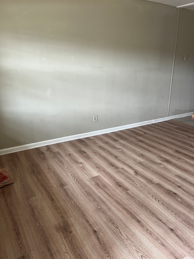 empty room with light hardwood / wood-style floors