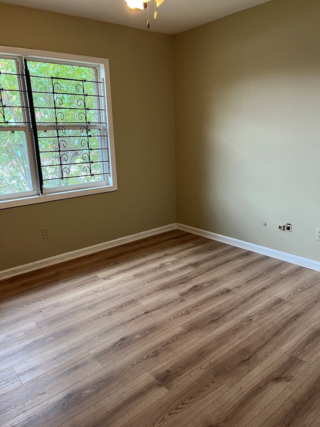 spare room with plenty of natural light and light wood-type flooring