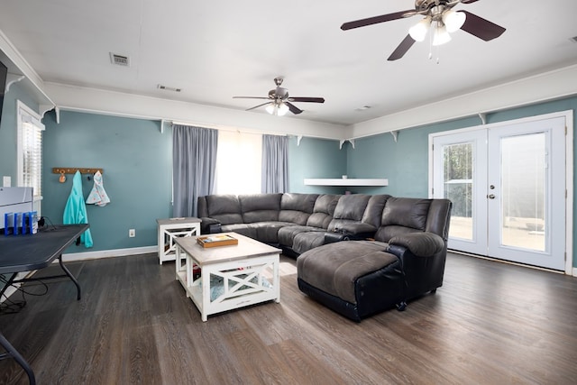 living area with a healthy amount of sunlight, visible vents, french doors, and dark wood-style flooring