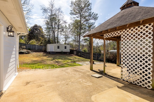 view of patio / terrace featuring a fenced backyard and an outdoor structure