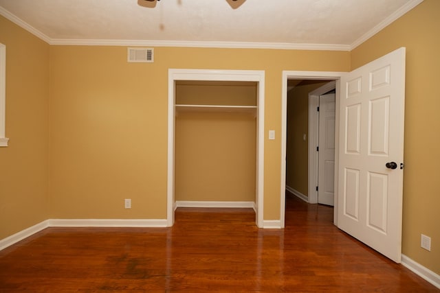 unfurnished bedroom with dark hardwood / wood-style floors, ceiling fan, and ornamental molding