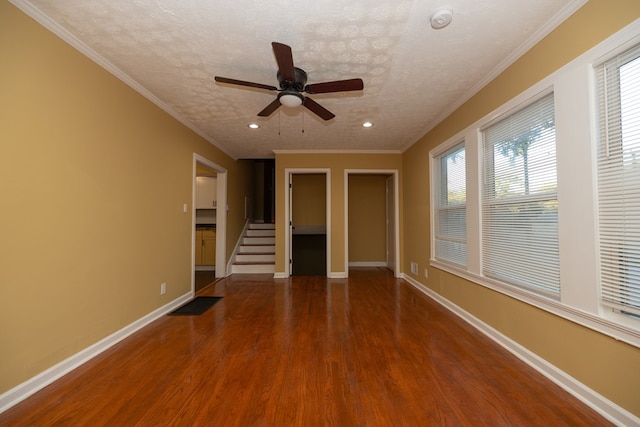 unfurnished living room featuring hardwood / wood-style floors, a textured ceiling, and a healthy amount of sunlight