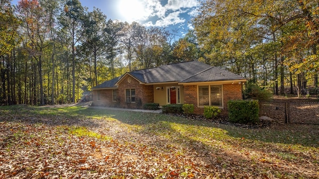 ranch-style house featuring a front lawn