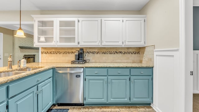 kitchen featuring dishwasher, white cabinets, and blue cabinetry