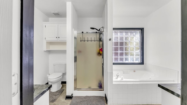 bathroom with tile patterned flooring, shower with separate bathtub, and toilet