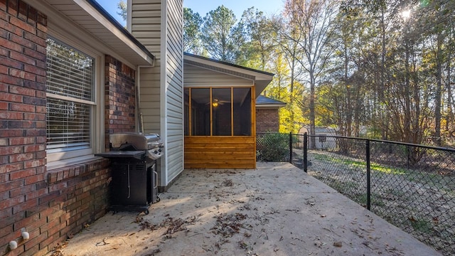 view of patio / terrace with a sunroom and grilling area