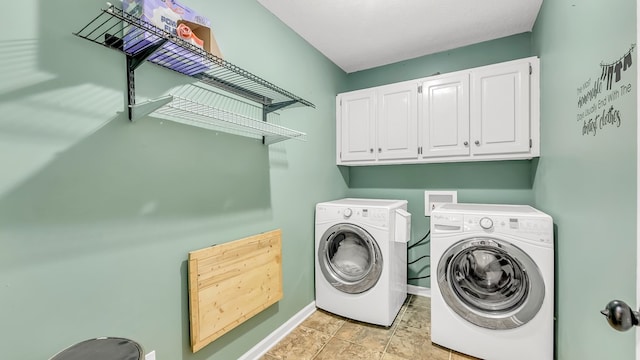 laundry area featuring cabinets and independent washer and dryer