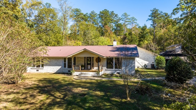 ranch-style home with central AC unit, a porch, and a front lawn