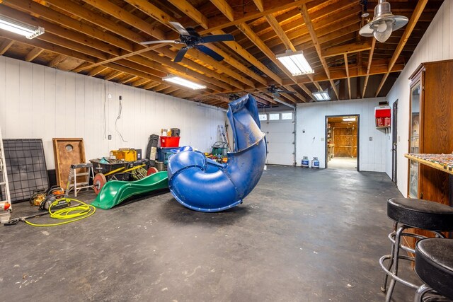 garage featuring wooden walls