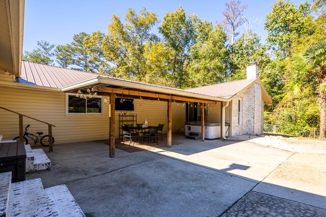 exterior space featuring a hot tub