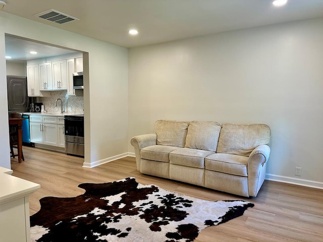 6231 Lynridge Ave, Columbus, GA 31909 - living area with light wood-style floors, recessed lighting, and baseboards