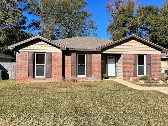 single story home featuring a front yard