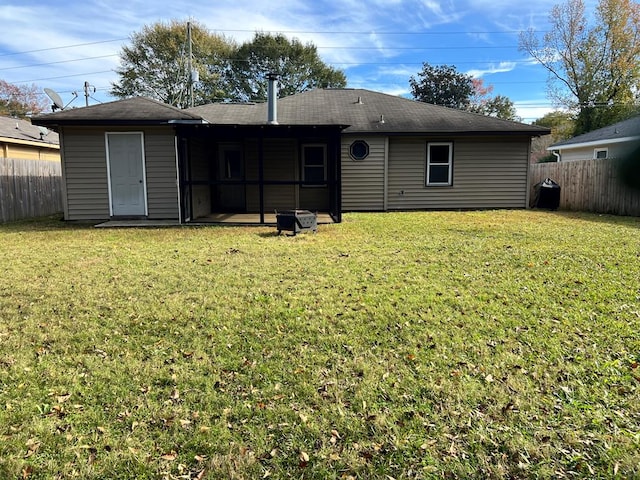 back of house with a yard