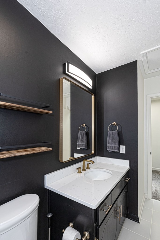 1305 Forest Ave Unit 00011, Columbus, GA 31906 - bathroom featuring vanity, tile patterned floors, toilet, and a textured ceiling