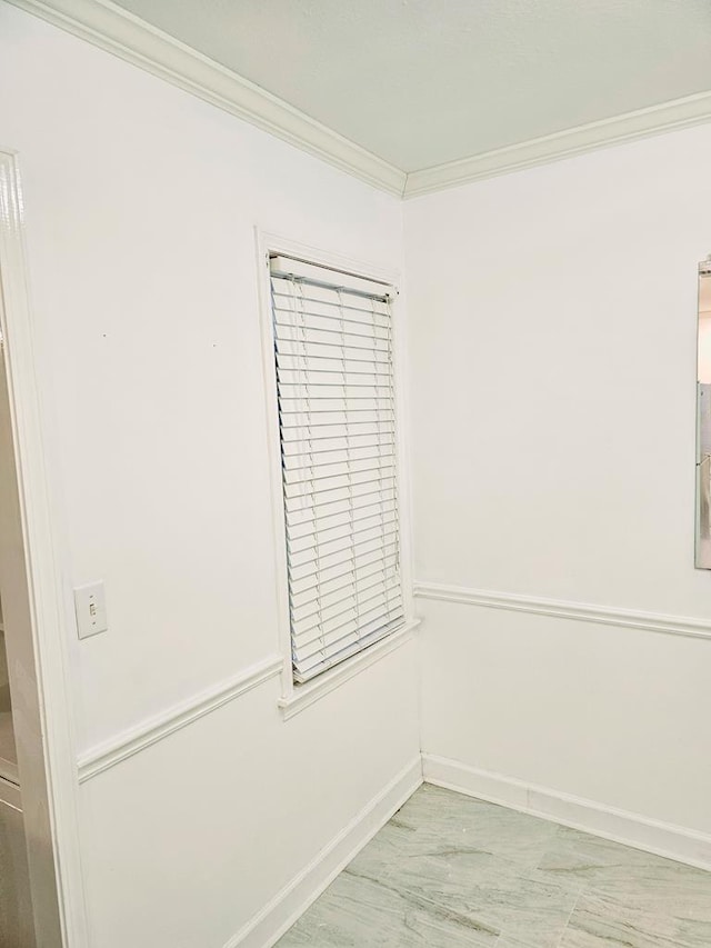 unfurnished room with ornamental molding