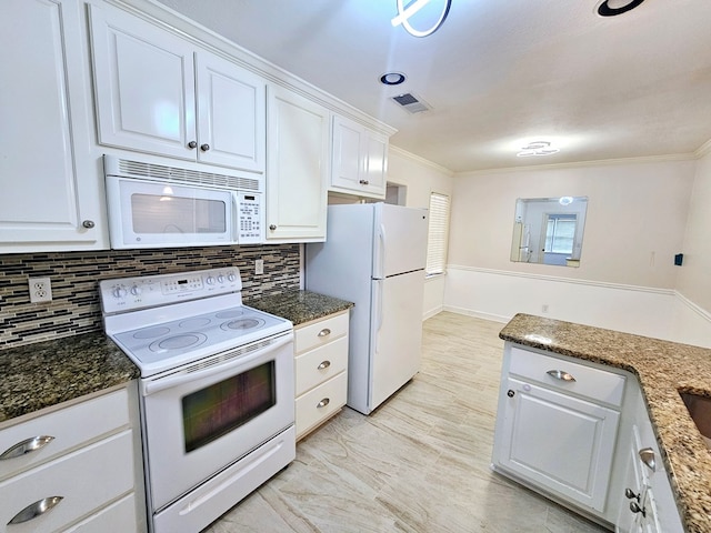 kitchen featuring white cabinets, white appliances, and backsplash