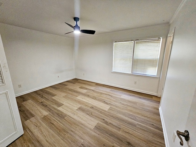 unfurnished room with ceiling fan and light hardwood / wood-style flooring