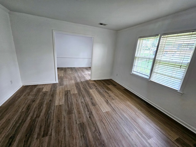 spare room with dark hardwood / wood-style flooring