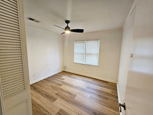 spare room with ceiling fan, light hardwood / wood-style flooring, and ornamental molding