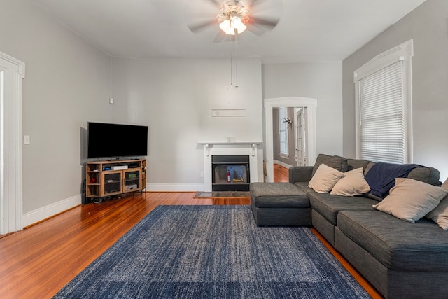 619 3rd Ave, Columbus, GA 31901 - living room featuring wood finished floors, ceiling fan, baseboards, and a fireplace