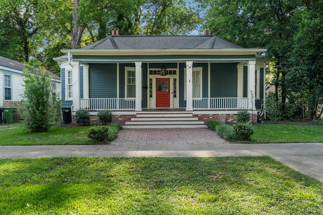 619 3rd Ave, Columbus, GA 31901 - view of front of house with a porch, a front lawn, and a chimney