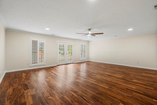 empty room featuring visible vents, dark wood-type flooring, french doors, baseboards, and ceiling fan