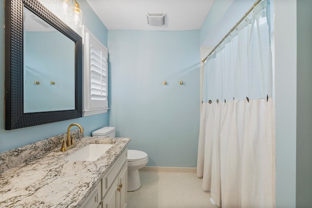 bathroom with visible vents, baseboards, toilet, tile patterned floors, and vanity