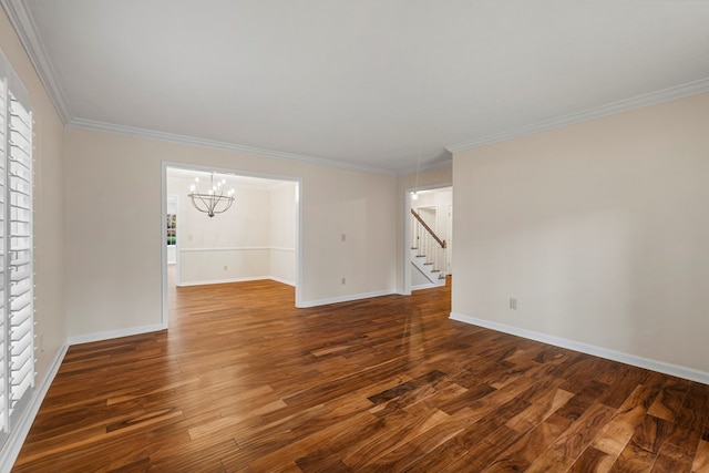 unfurnished room with dark wood finished floors, baseboards, and ornamental molding