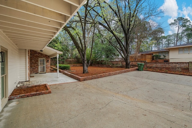 view of patio featuring fence